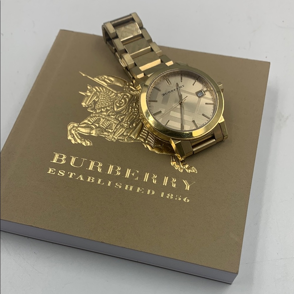 Women’s Burberry Gold Watch.